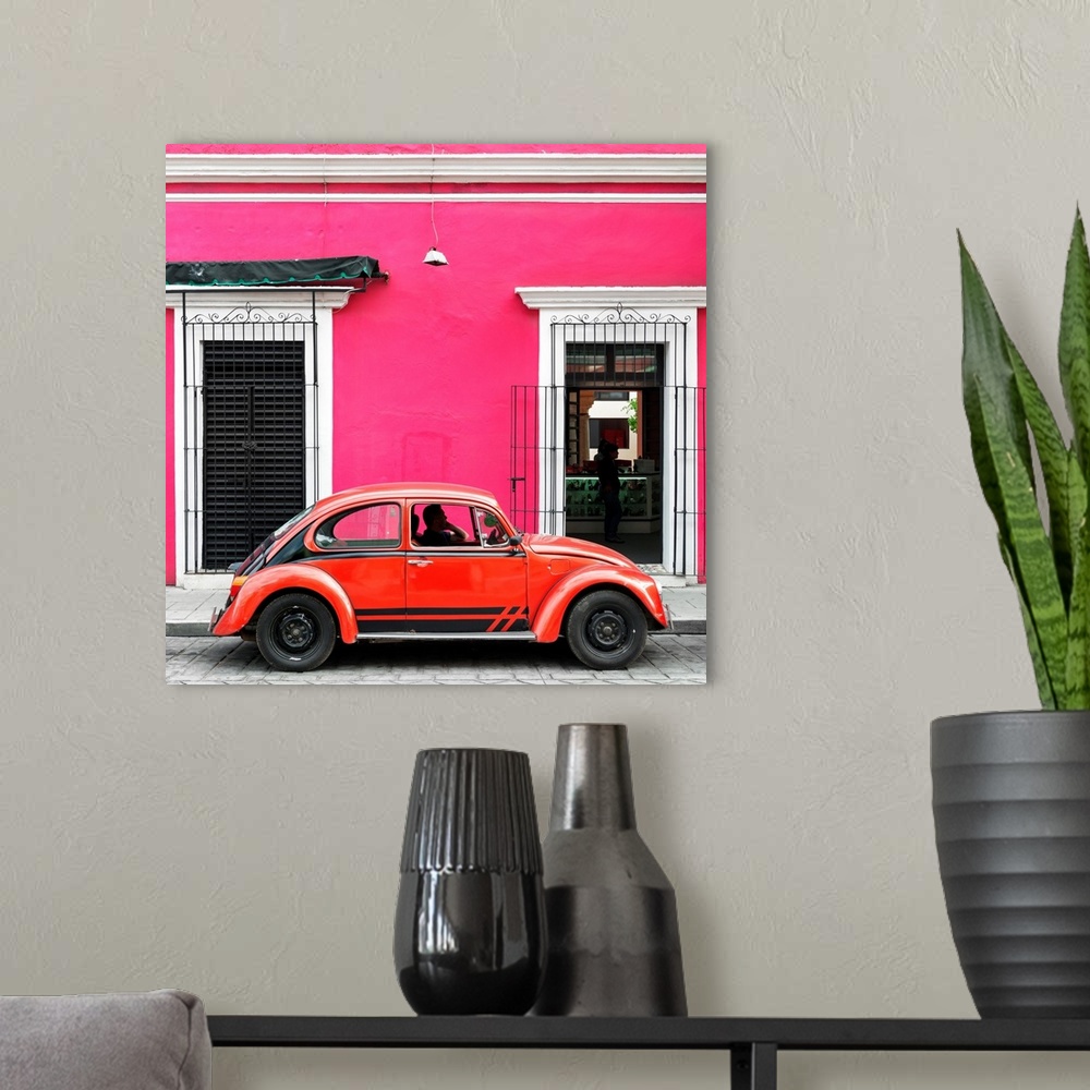 A modern room featuring Square photograph of a classic red Volkswagen Beetle parked in front of a pink building. From the...