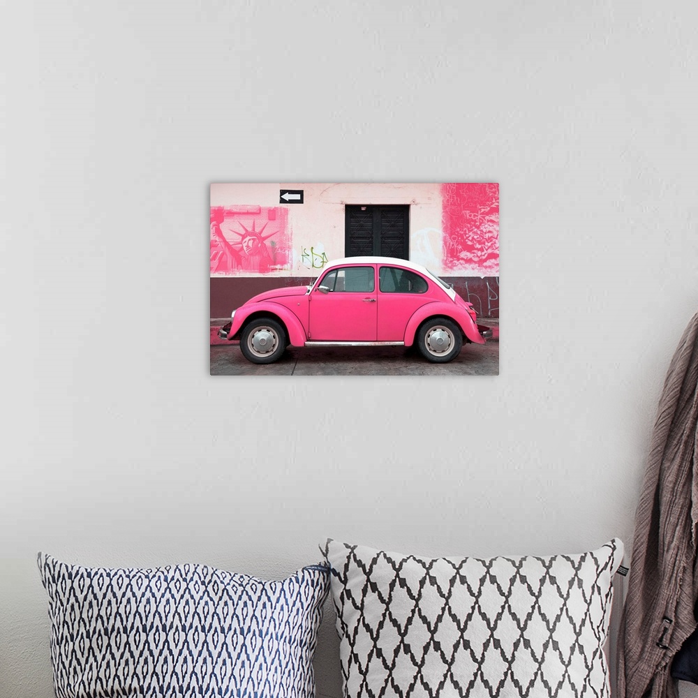 A bohemian room featuring Photograph of a pink Volkswagen Beetle parked in front of a wall covered in pink American graffit...