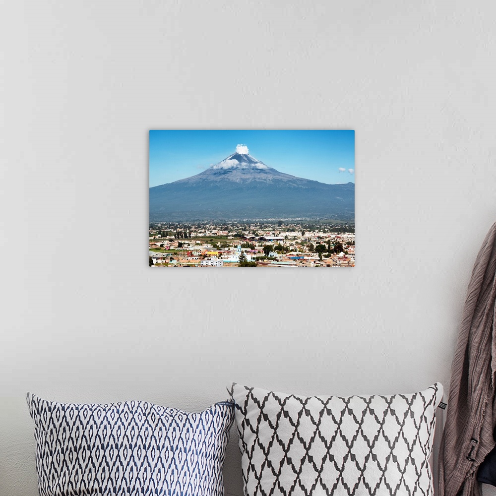 A bohemian room featuring Photograph of the Popocatepetl Volcano in Puebla, Mexico with a view of the city below. From the ...