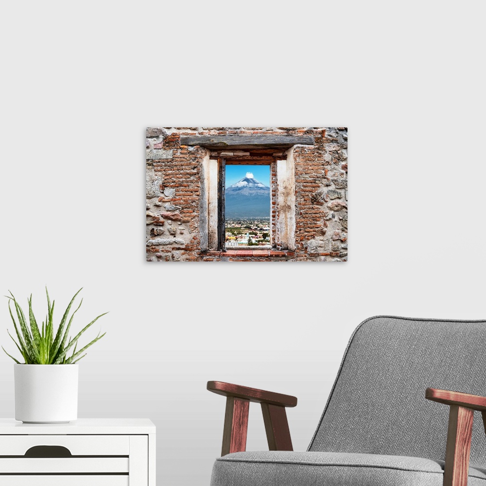 A modern room featuring View of the Popocatepetl Volcano in Puebla, Mexico, framed through a stony, brick window. From th...