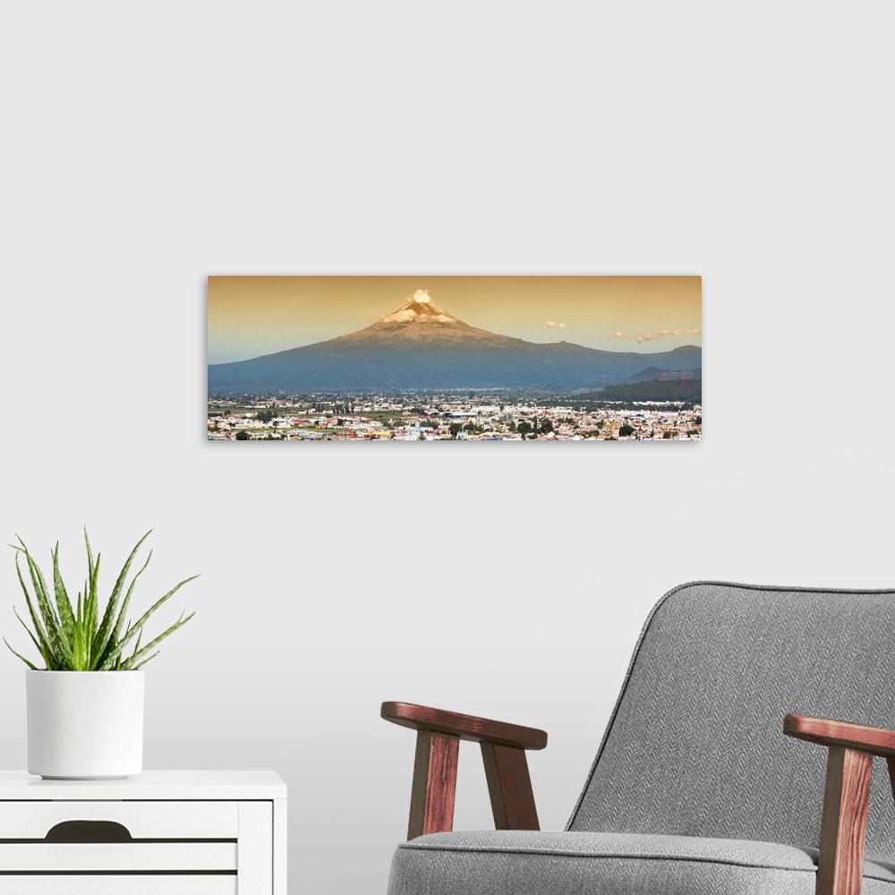 A modern room featuring Panoramic aerial photograph of the Popocatepetl Volcano in Puebla, Mexico, with a bird's eye view...