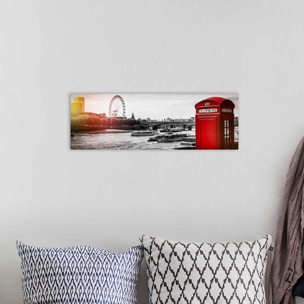A bohemian room featuring An iconic red phone booth with the London Eye across the Thames, London, England.