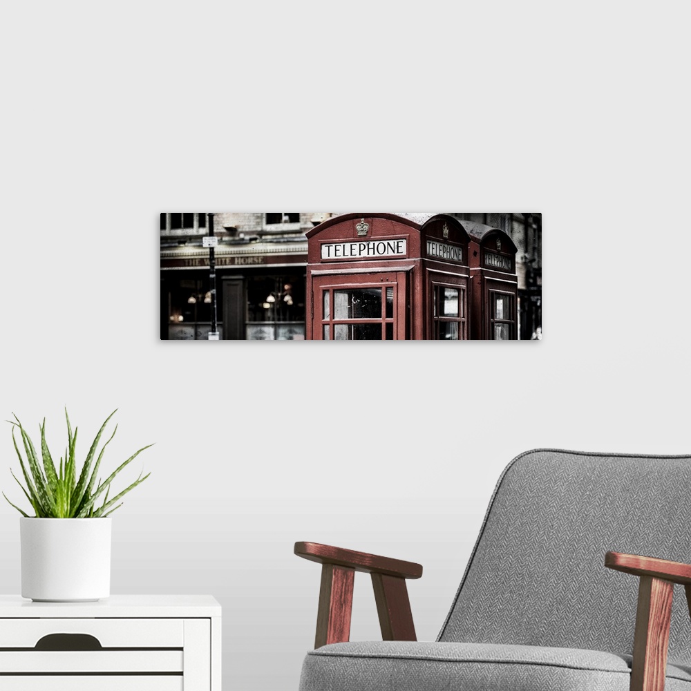 A modern room featuring Fine art photograph of an iconic red phone booth in London, England.