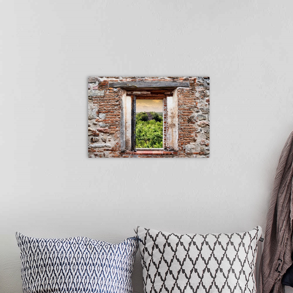 A bohemian room featuring View of the Ruins of the ancient Mayan City of Calakmul, Mexico, framed through a stony, brick wi...