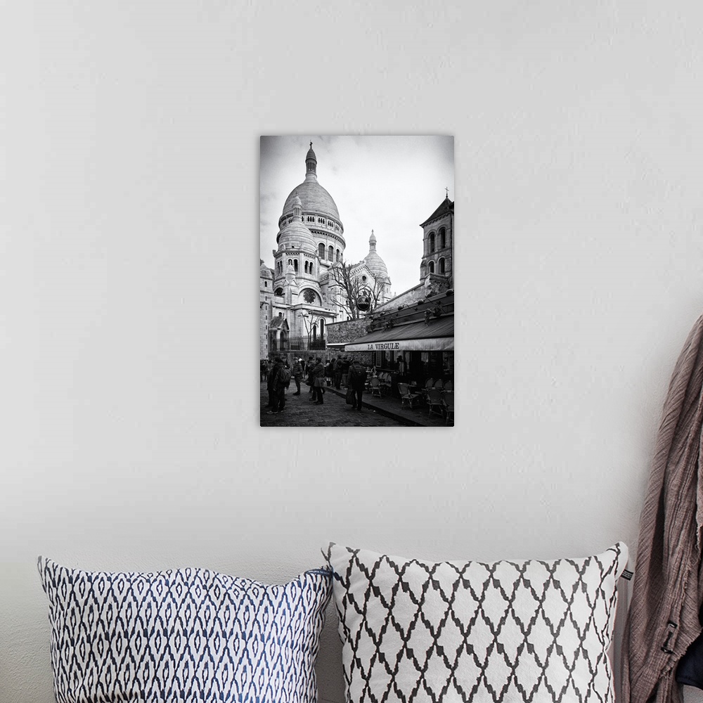 A bohemian room featuring Black and white photo of the Sacre Coeur Basilica, showing the dome architecture.