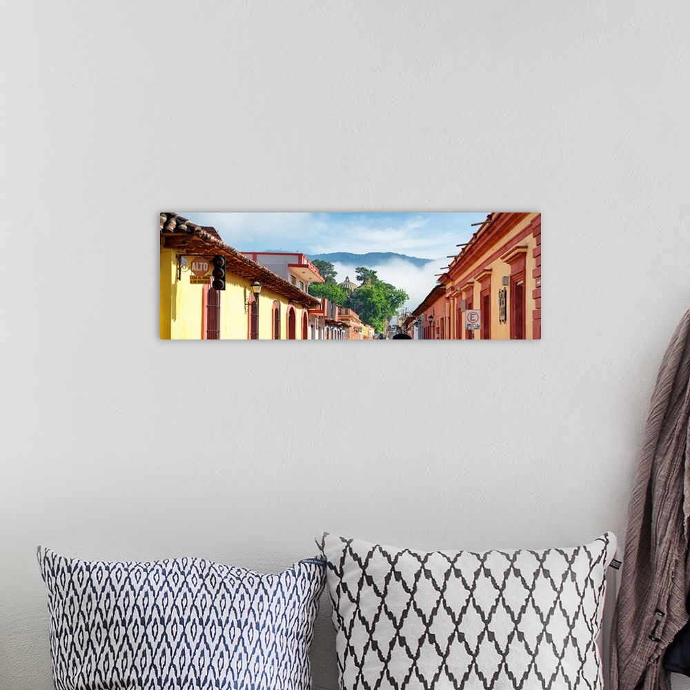 A bohemian room featuring Panoramic photograph of a streetscape at San Cristobal de Las Casas in Chiapas, Mexico, with heav...