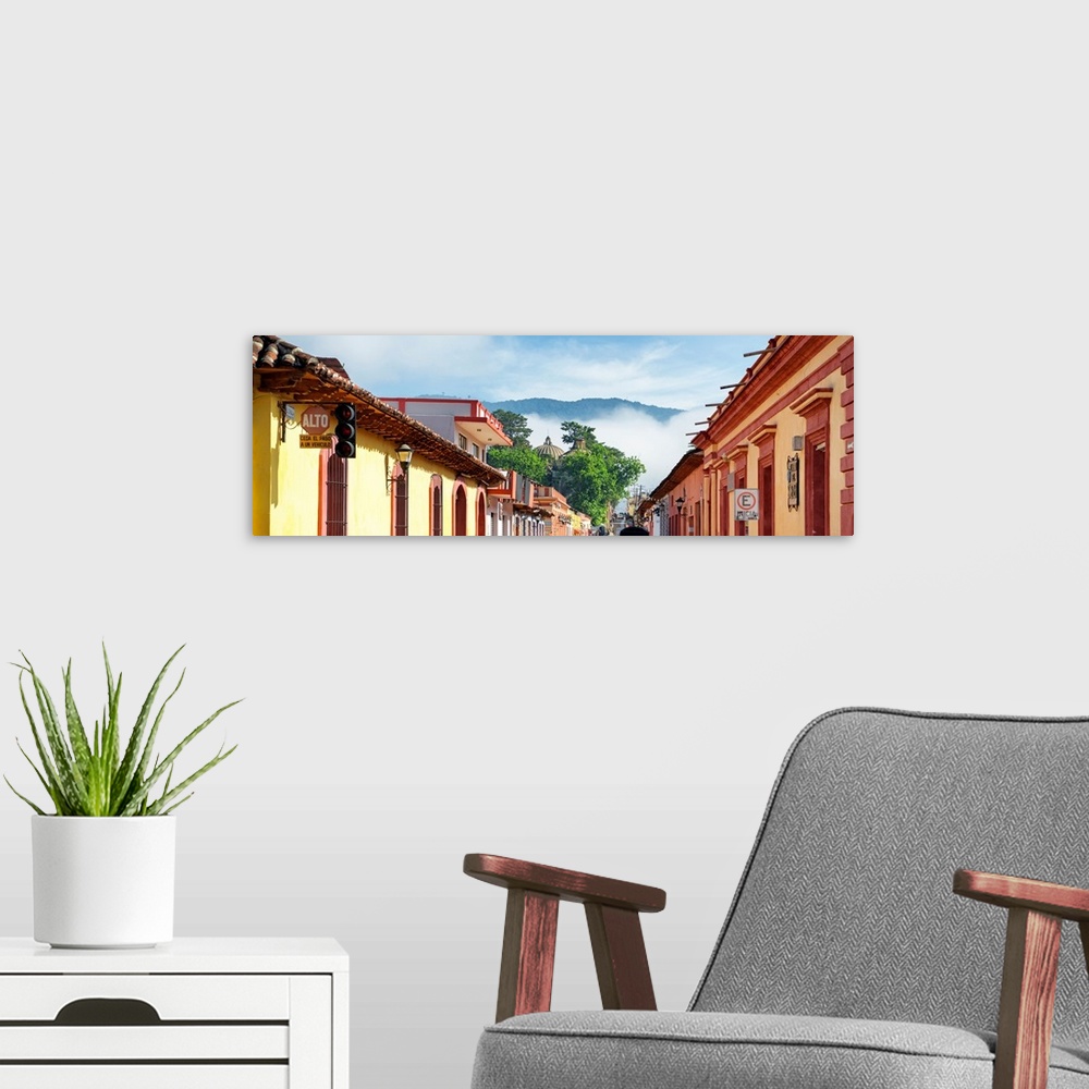 A modern room featuring Panoramic photograph of a streetscape at San Cristobal de Las Casas in Chiapas, Mexico, with heav...