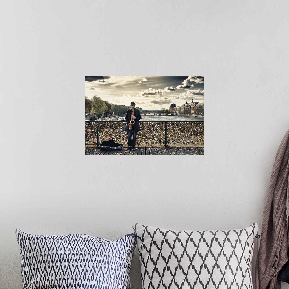 A bohemian room featuring Fine art photo of a man playing the saxophone on bridge covered in locks in Paris, France.