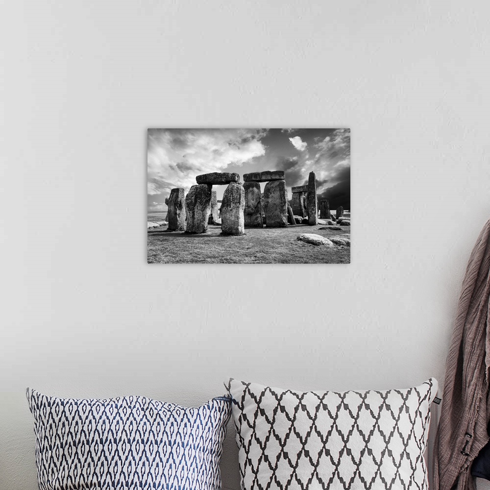 A bohemian room featuring Fine art photograph of the prehistoric monument of Stonehenge.