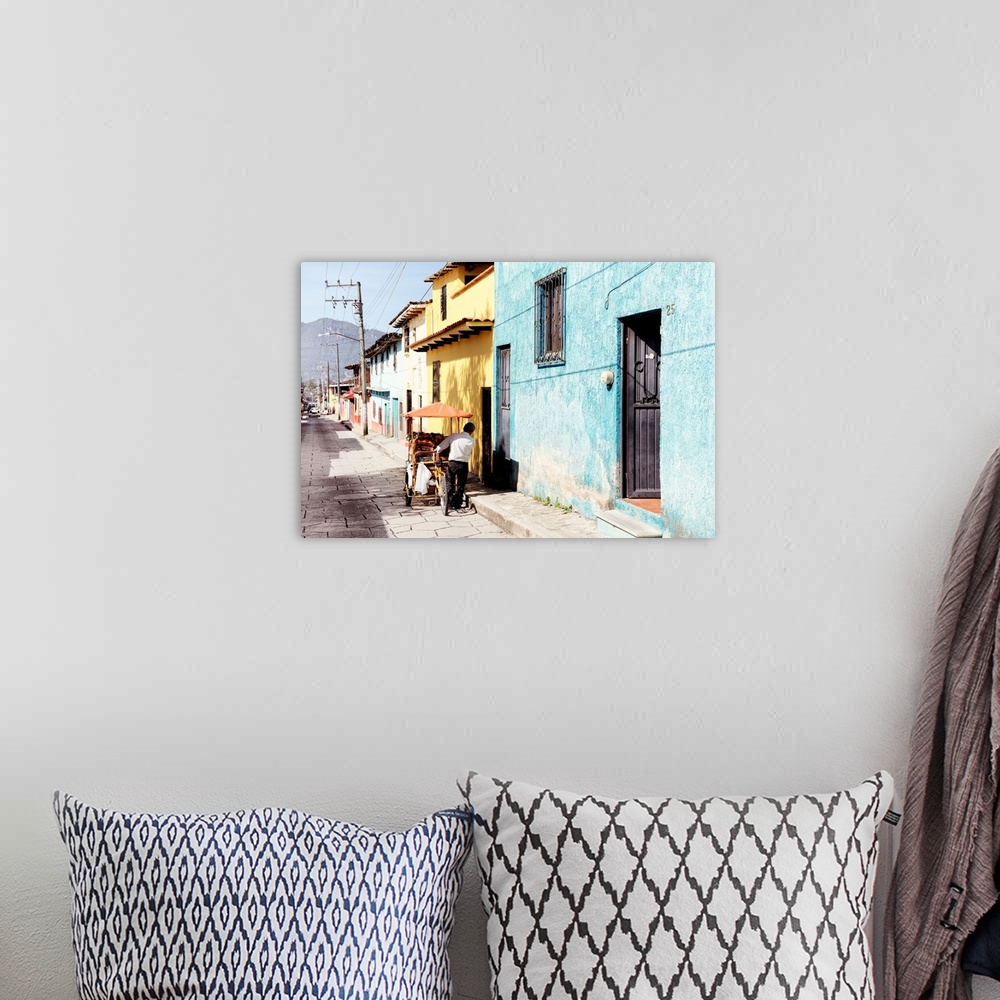 A bohemian room featuring Photograph of a street vendor pushing his cart full of fresh fruit down a colorful street in Mexi...