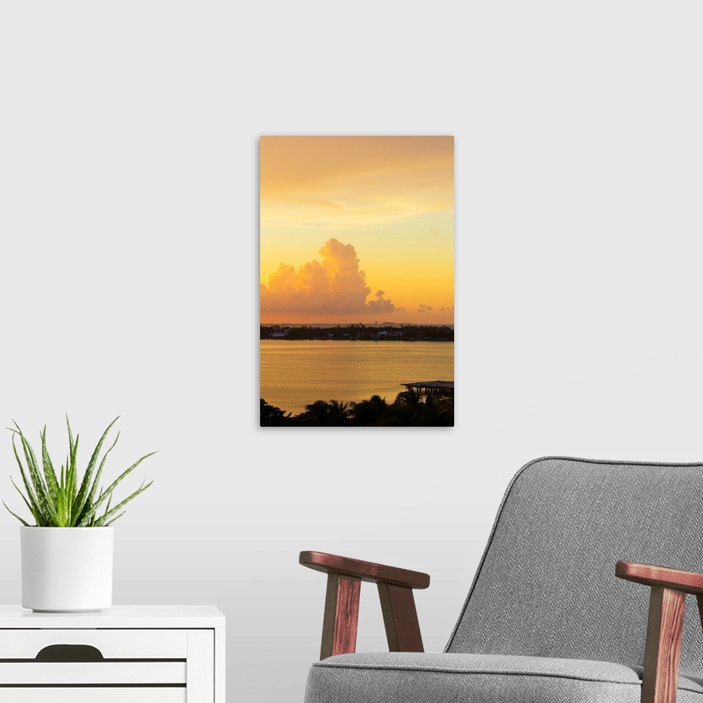 A modern room featuring Photograph of a beautiful orange, pink, and yellow sunset over Cancun, Mexico. From the Viva Mexi...