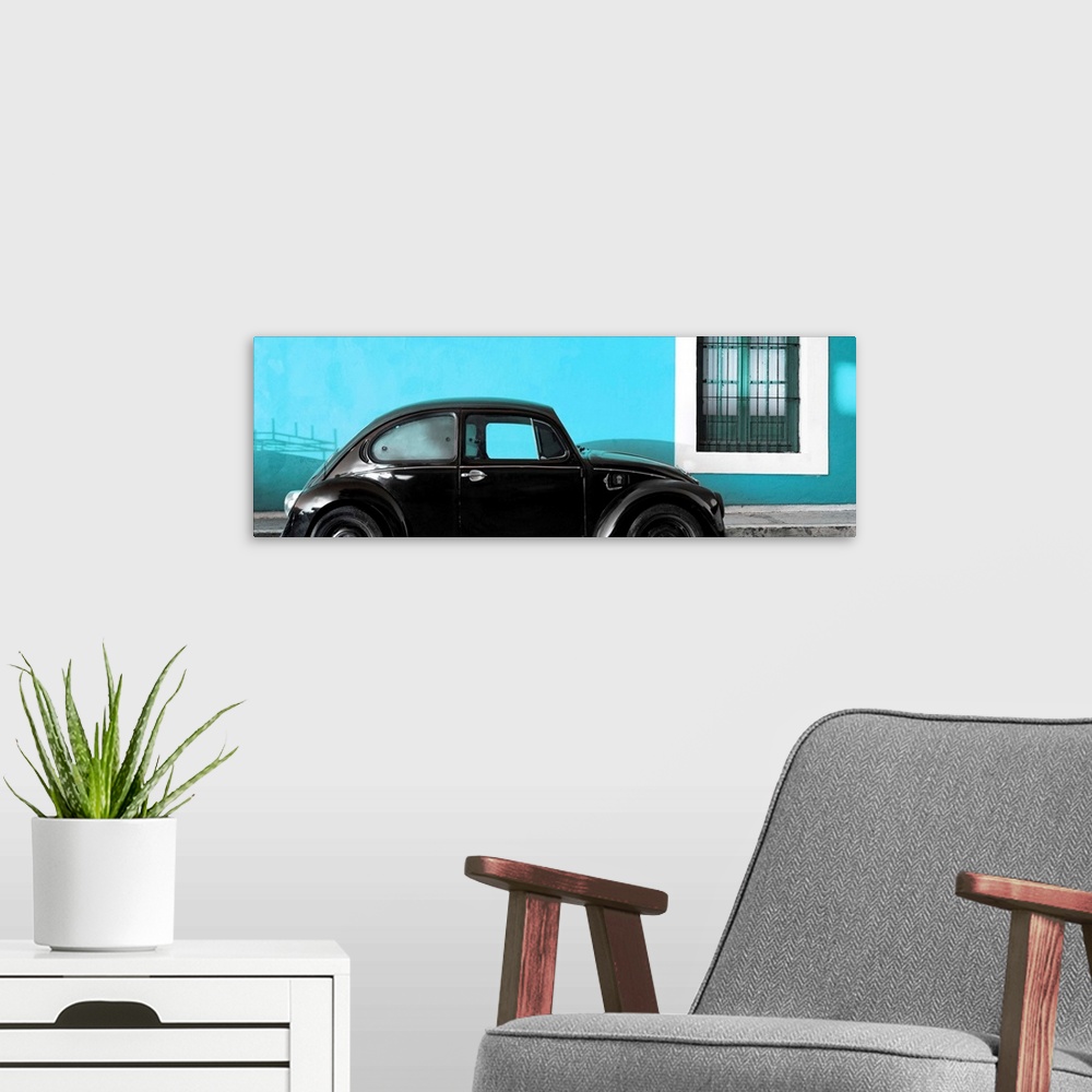 A modern room featuring Panoramic photograph of a classic black Volkswagen Beetle parked in front of a bright turquoise w...
