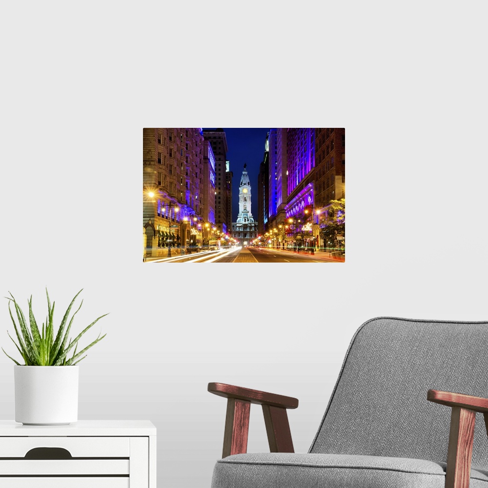 A modern room featuring Fine art photograph of City Hall in Philadelphia in the evening, with light trails in the street.
