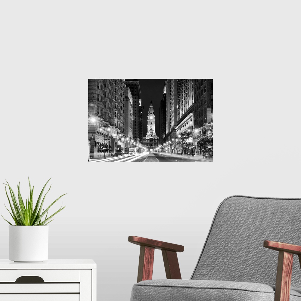 A modern room featuring Fine art photograph of City Hall in Philadelphia in the evening, with light trails in the street.