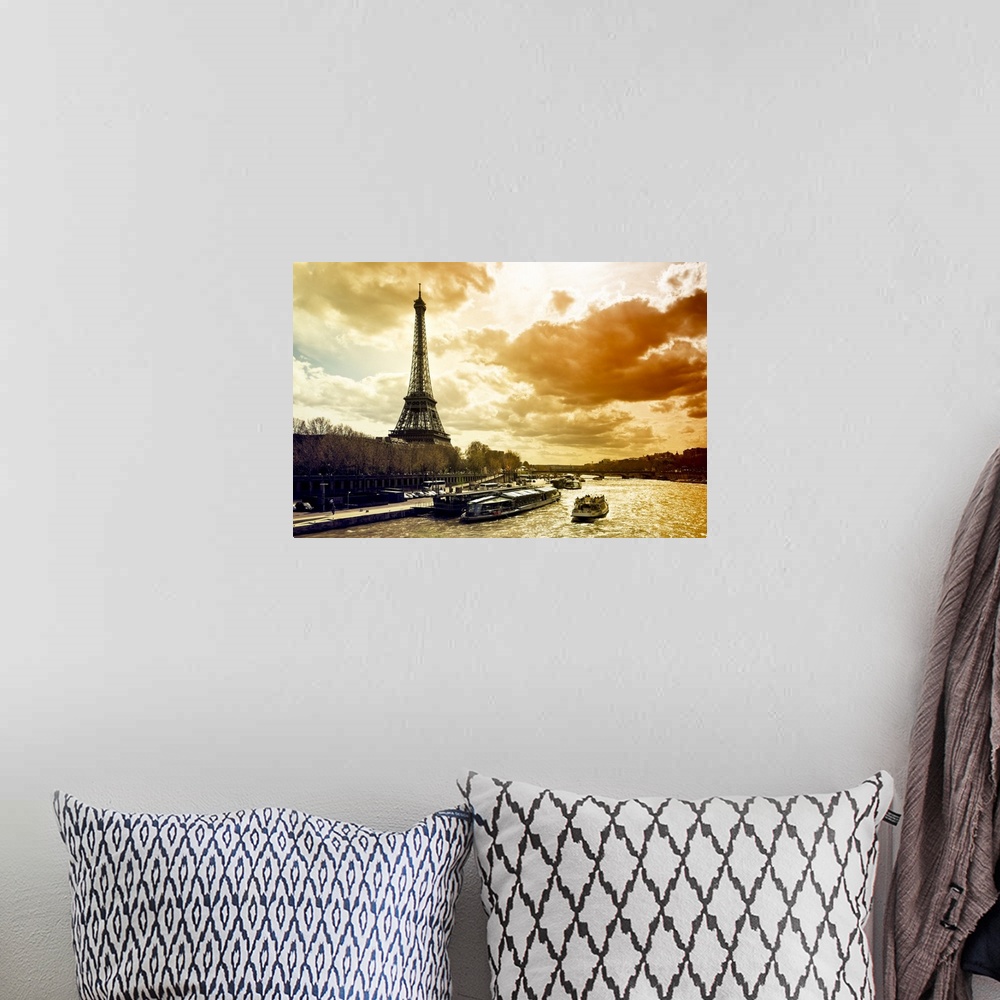 A bohemian room featuring Fine art photo of the Eiffel Tower on the edge of the Seine River with dramatic lighting from the...