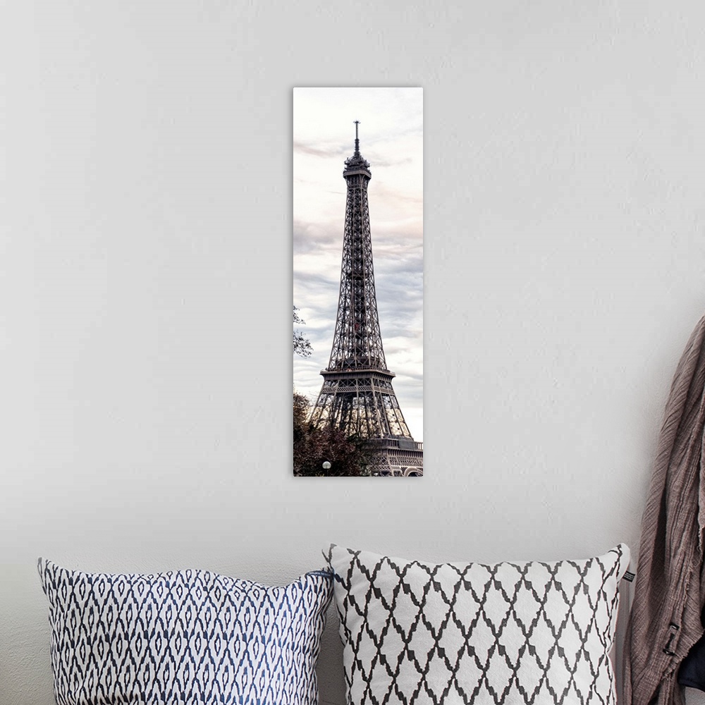 A bohemian room featuring View of the famous Eiffel Tower monument in Paris, France, against an overcast sky.