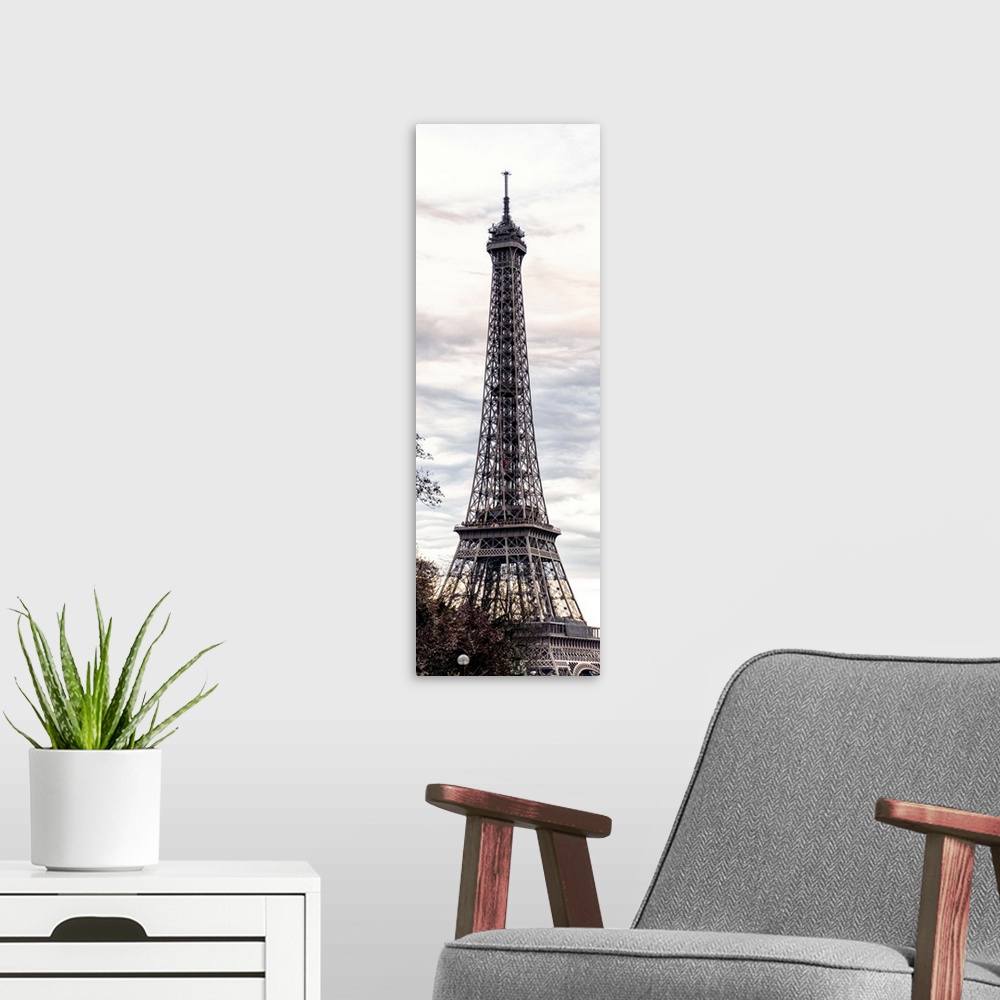 A modern room featuring View of the famous Eiffel Tower monument in Paris, France, against an overcast sky.