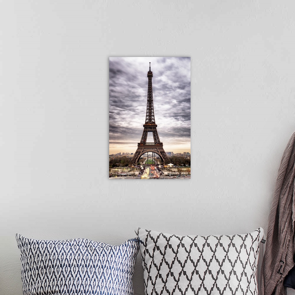 A bohemian room featuring Stunning photograph of the iconic Eiffel Tower in Paris with cloudy skies.