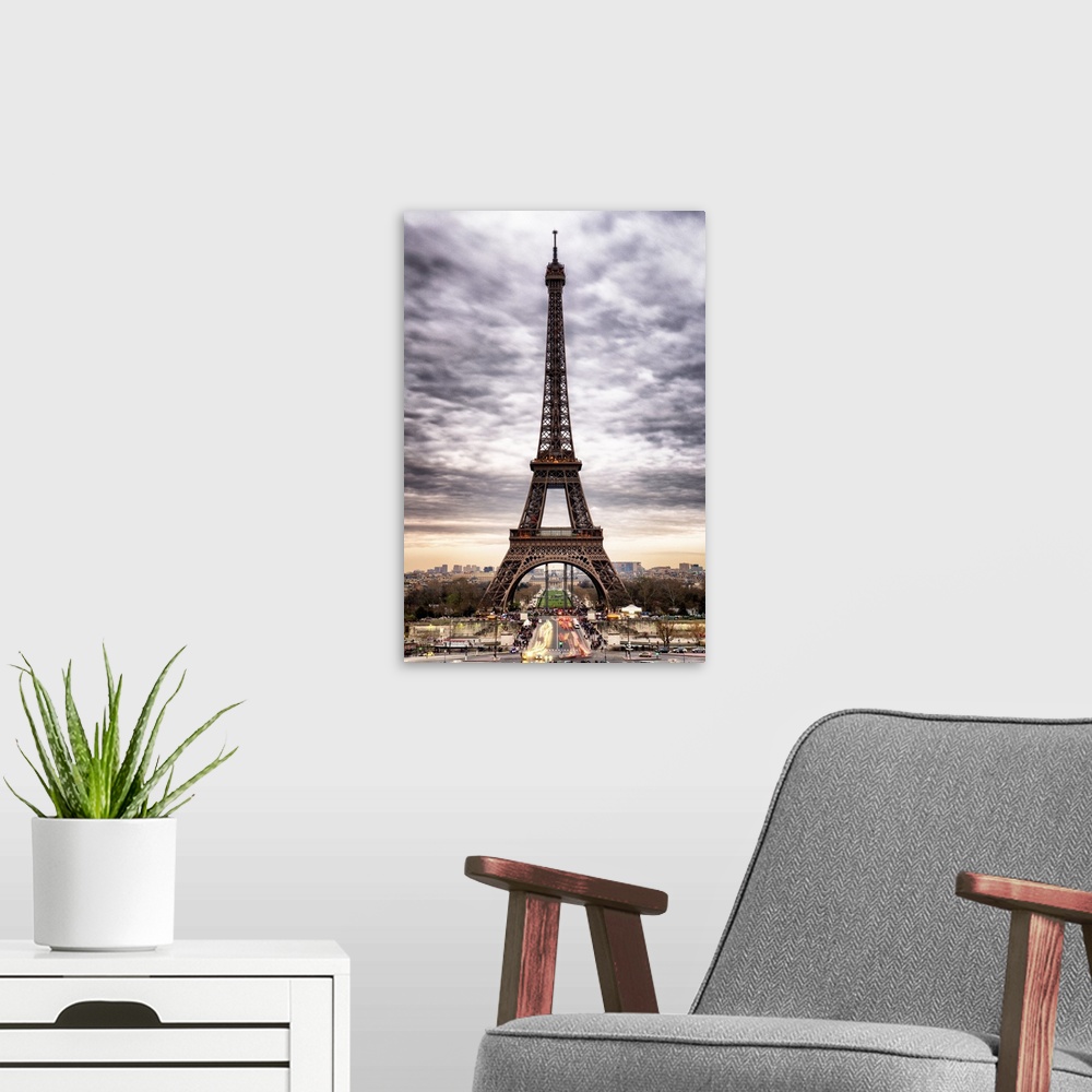 A modern room featuring Stunning photograph of the iconic Eiffel Tower in Paris with cloudy skies.