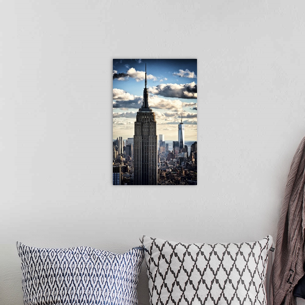 A bohemian room featuring Two skyscrapers towering over the New York City skyline under dramatic clouds.