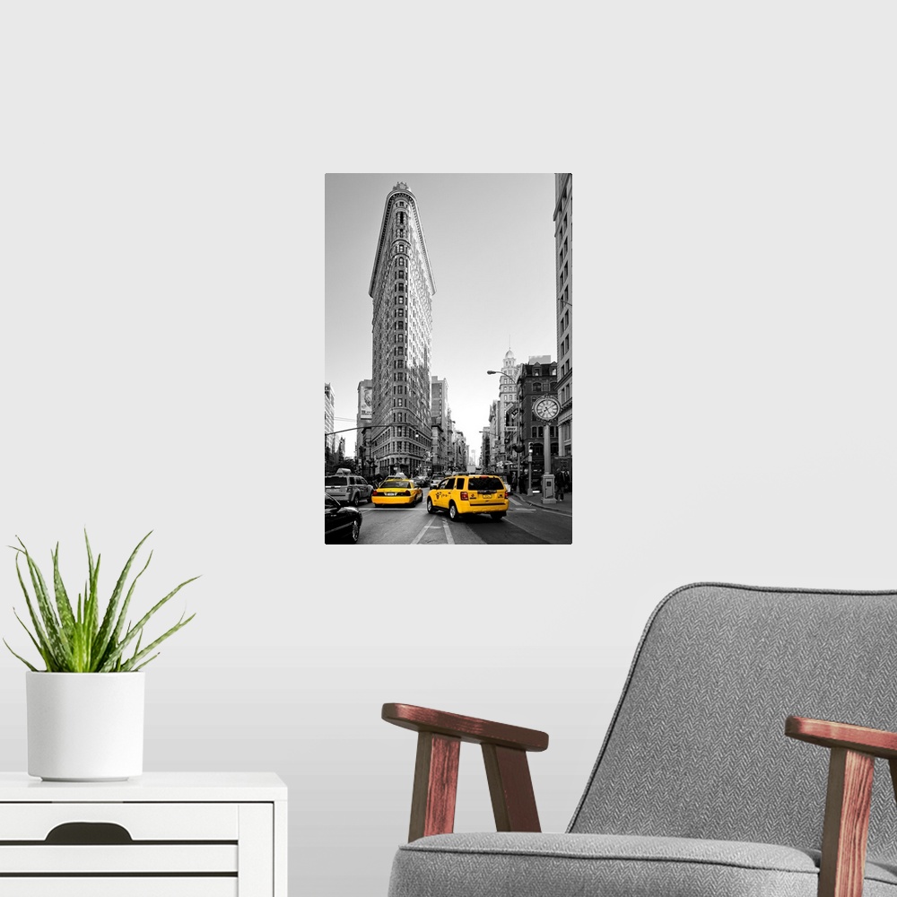 A modern room featuring Fine art photo of the Flatiron Building, seen from the street, with yellow taxi cabs.