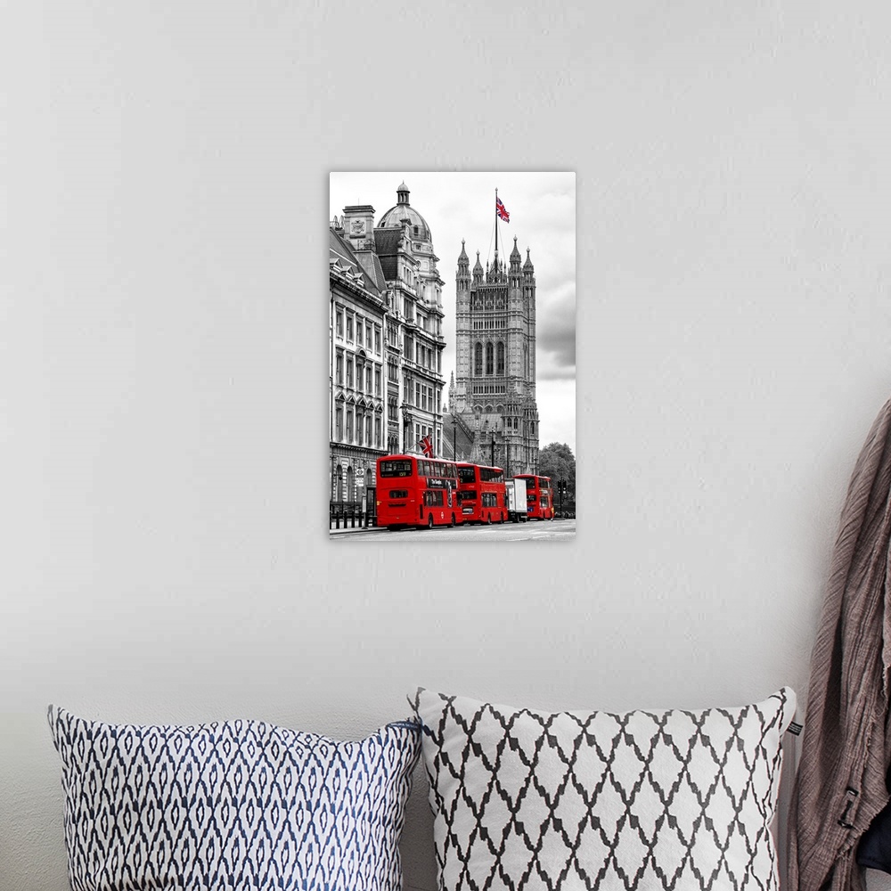 A bohemian room featuring Row of double decker buses on the street by the House of Parliament in London, England.