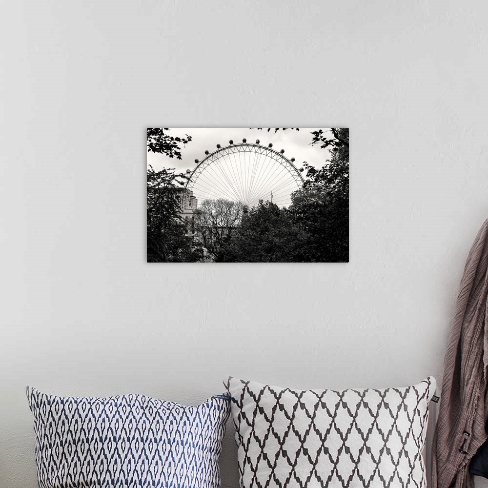 A bohemian room featuring Black and white photo of the London Eye behind trees in London, England.