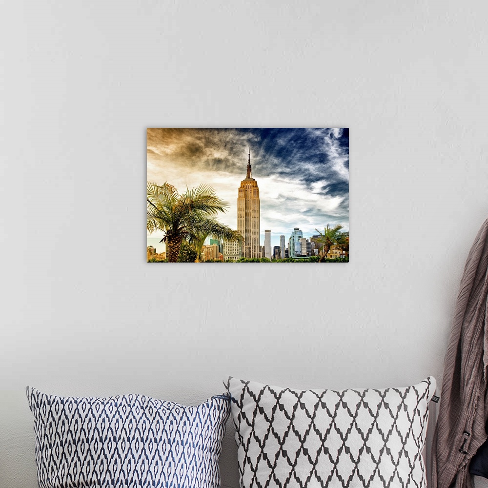 A bohemian room featuring Fine art photo of the Empire State Building under a dramatic sky.