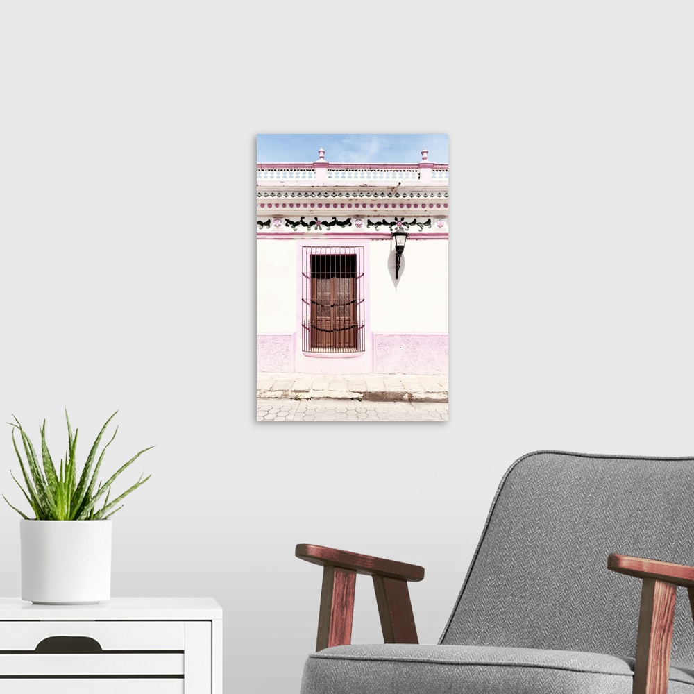 A modern room featuring Photograph of a pink and white exterior to a building with detailed designs above the window. Fro...