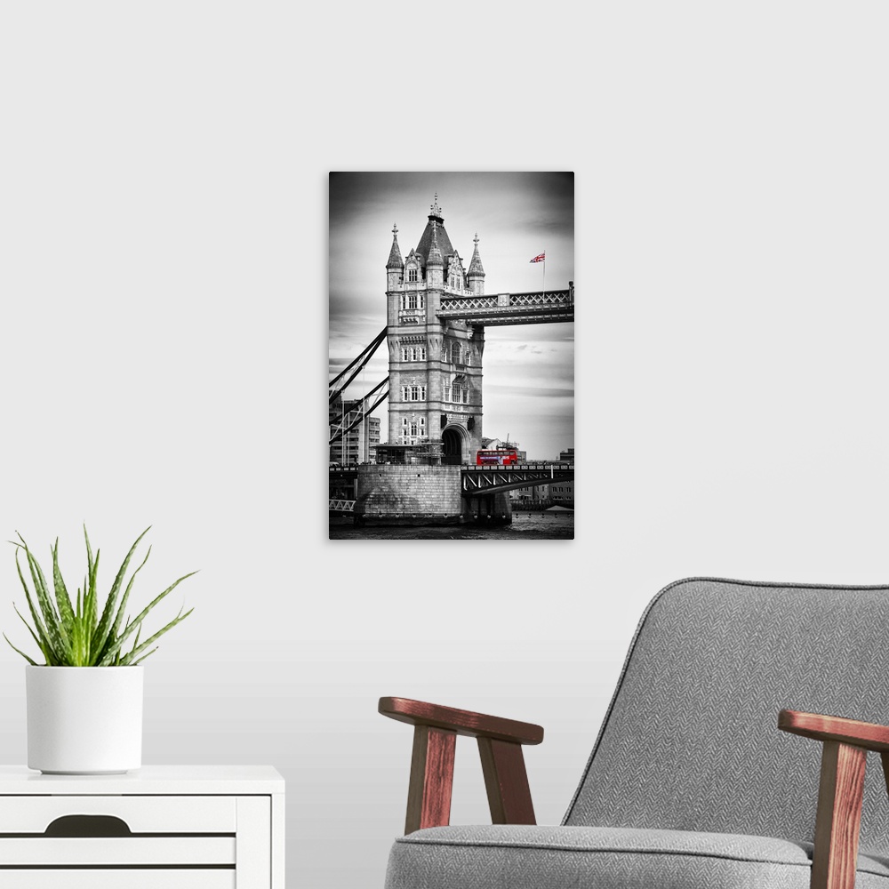 A modern room featuring Fine art photo of the Tower Bridge in London with a double decker bus, with selective color.