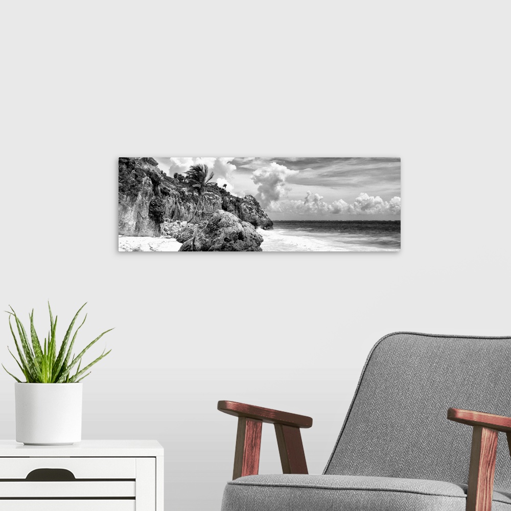 A modern room featuring Black and white panoramic photograph of a rocky Caribbean beach shore in Tulum, Mexico. From the ...