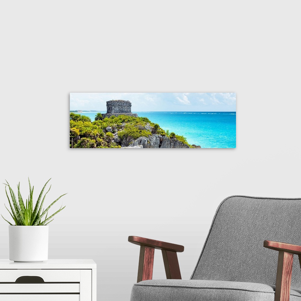 A modern room featuring Panoramic photo of ancien Mayan ruins in Tulum, Mexico, overlooking the clear blue Caribbean ocea...