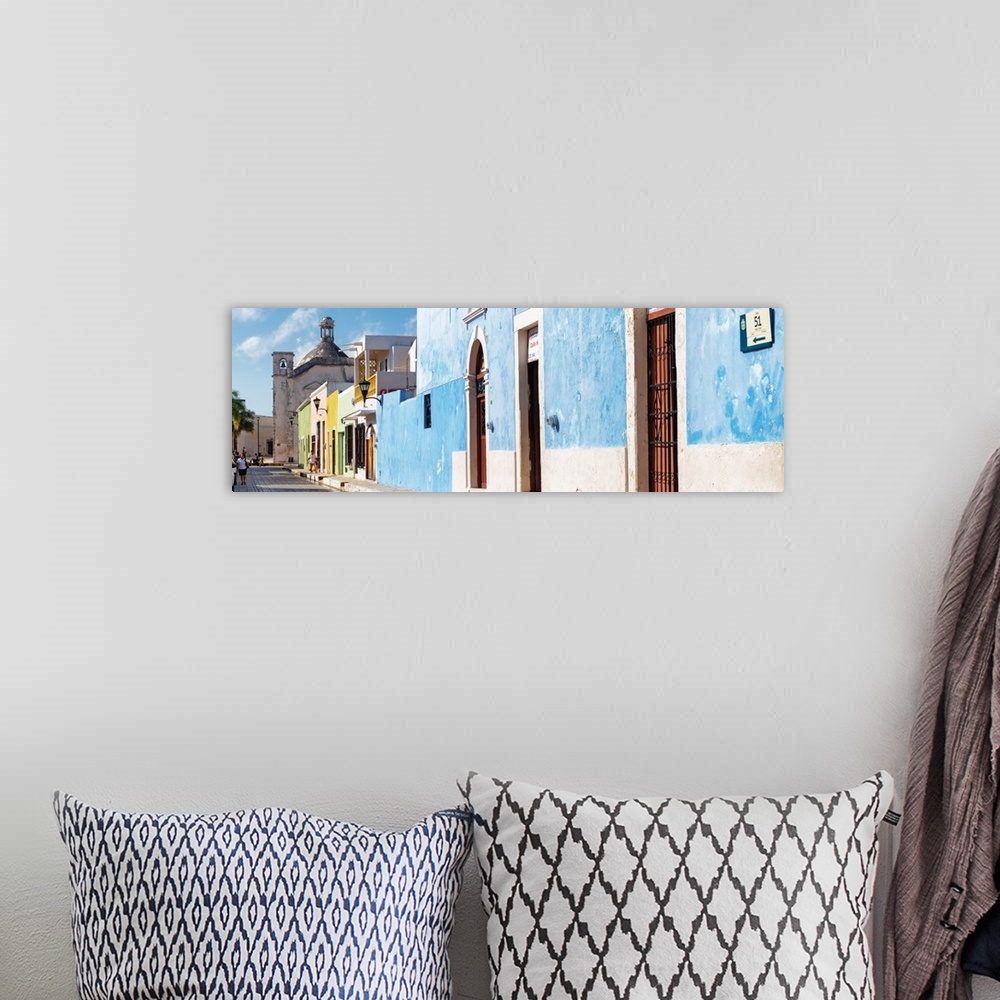 A bohemian room featuring Panoramic photograph of a street scene in Campeche, Mexico, with a bright blue building. From the...
