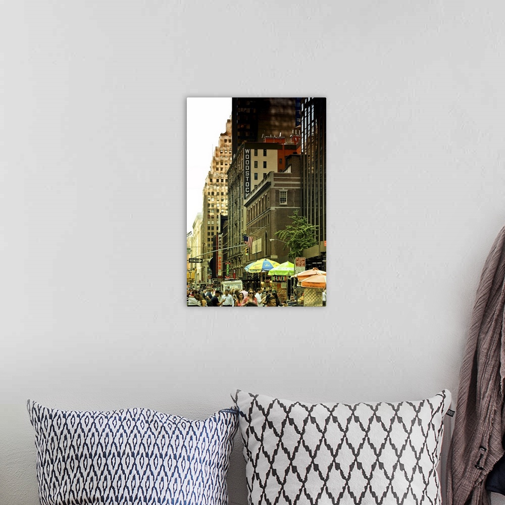 A bohemian room featuring Fine art photo of a crowded street and tall buildings in Manhattan.