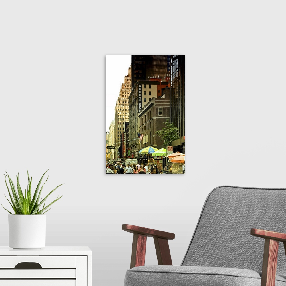 A modern room featuring Fine art photo of a crowded street and tall buildings in Manhattan.