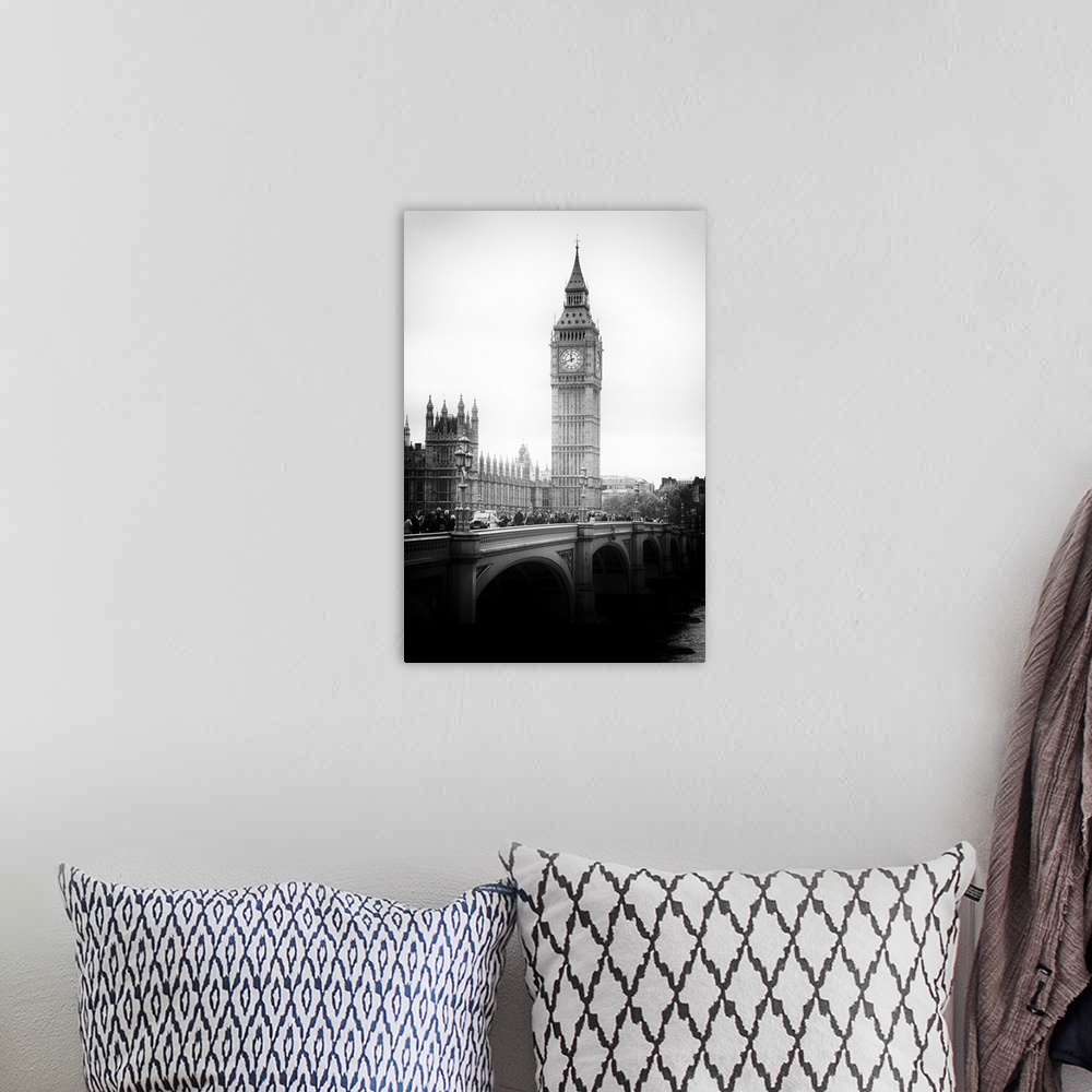A bohemian room featuring Black and white photo with dramatic lighting of the Big Ben clock tower.