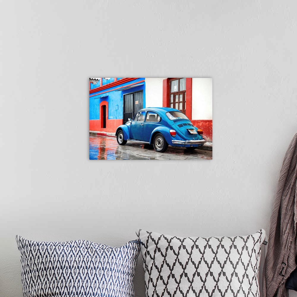 A bohemian room featuring Photograph of a classic blue Volkswagen Beetle parked in front of a blue and red building. From t...