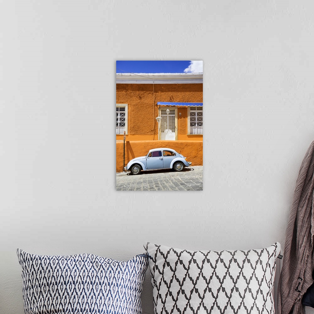 A bohemian room featuring Photograph of a classic Volkswagen Beetle in front of an orange and blue building. From the Viva ...