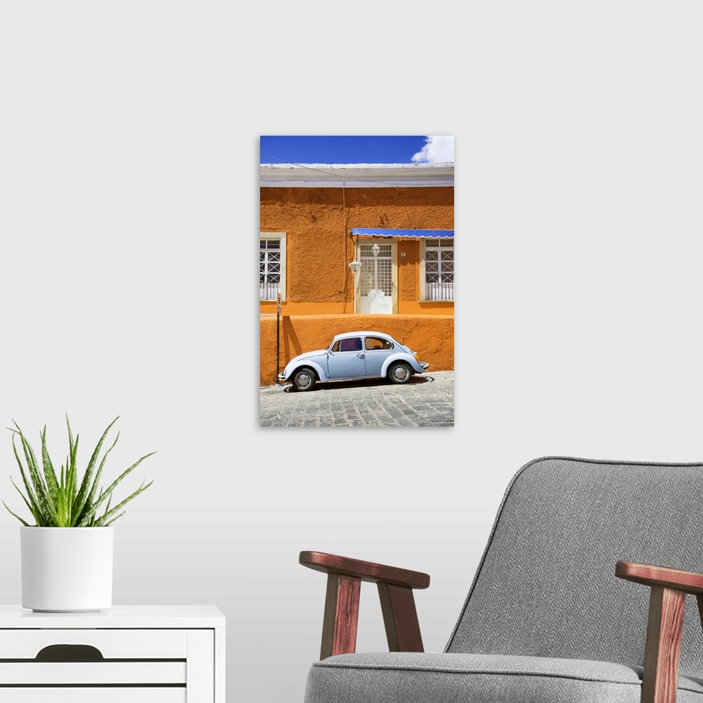 A modern room featuring Photograph of a classic Volkswagen Beetle in front of an orange and blue building. From the Viva ...