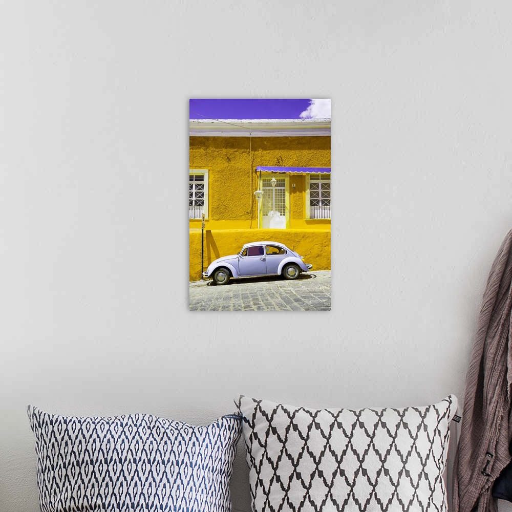 A bohemian room featuring Photograph of a classic Volkswagen Beetle in front of a yellow and purple building. From the Viva...