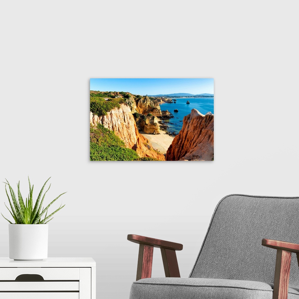 A modern room featuring It's a view of Lagos beach (Praia do Camillo) and orange cliffs in Portugal.