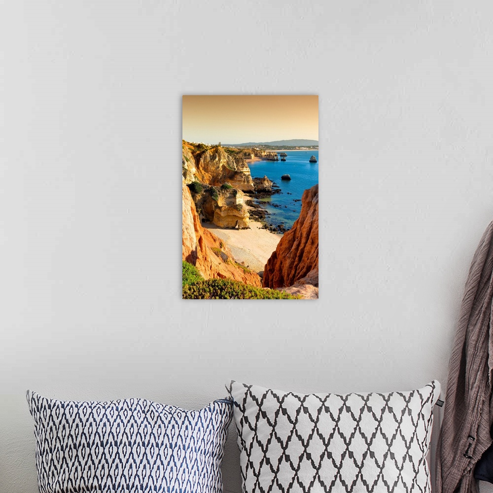 A bohemian room featuring It's a view at sunset of Lagos beach (Praia do Camillo) and orange cliffs in Portugal.