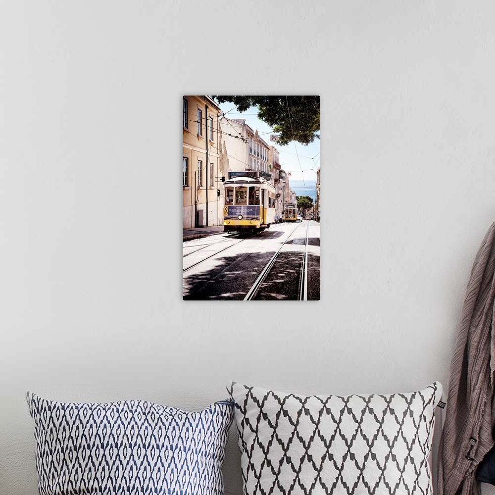 A bohemian room featuring This is the famous old yellow tramway 28 in the streets of lisbon in Portugal.