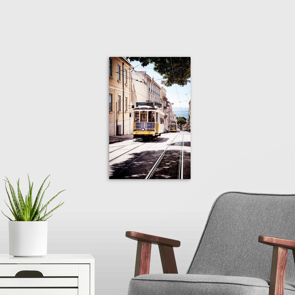 A modern room featuring This is the famous old yellow tramway 28 in the streets of lisbon in Portugal.