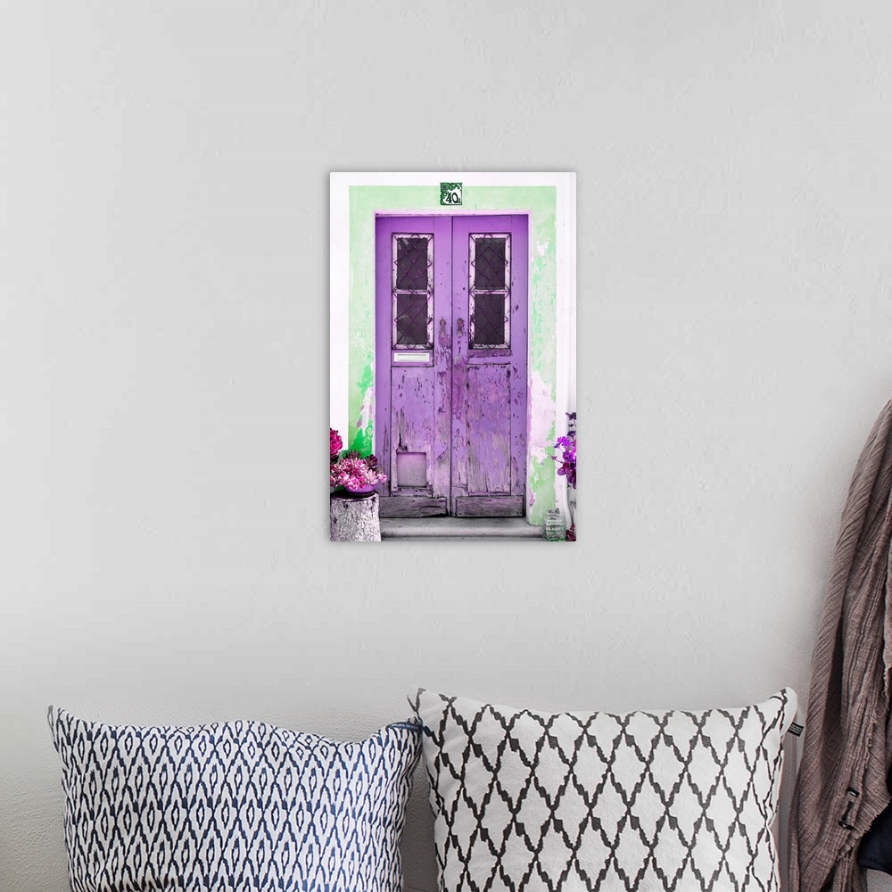 A bohemian room featuring It's an old purple door entrance to a traditional house in Portugal.