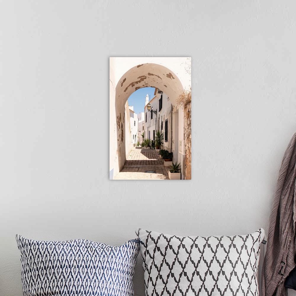 A bohemian room featuring It's a paved pedestrian street in the historic center of Faro in Portugal.