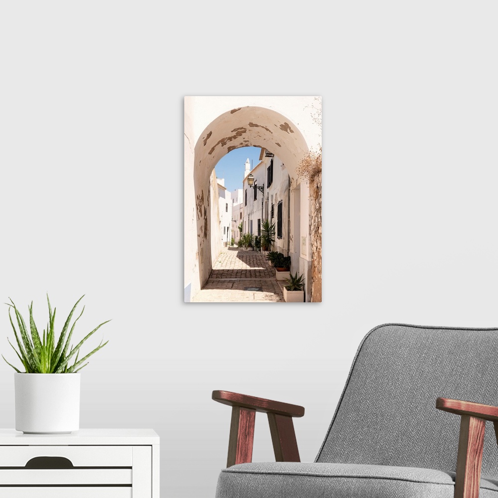 A modern room featuring It's a paved pedestrian street in the historic center of Faro in Portugal.