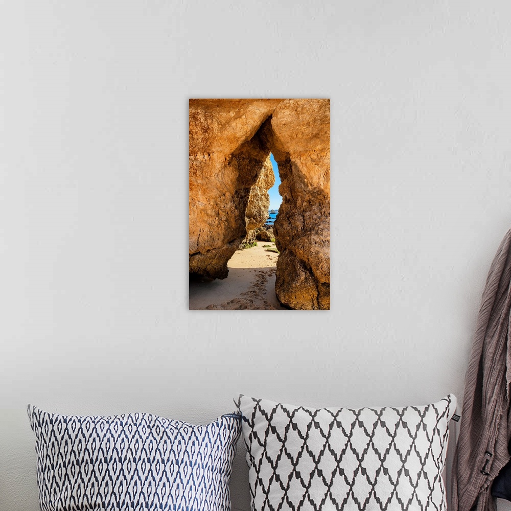 A bohemian room featuring It's a natural passage in a rock cliff on the beach of Praia do Camillo in Lagos (Portugal).