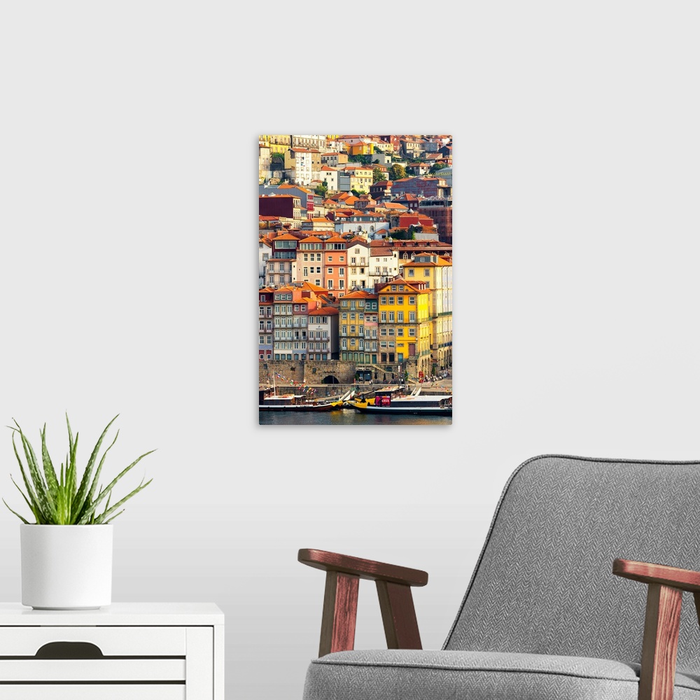 A modern room featuring This is a view of the Ribeira district in Porto on the banks of the Douro river at sunset with th...