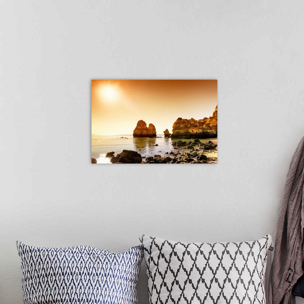 A bohemian room featuring It's a beautiful view of a sunset on the orange cliffs in Lagos (Portugal).